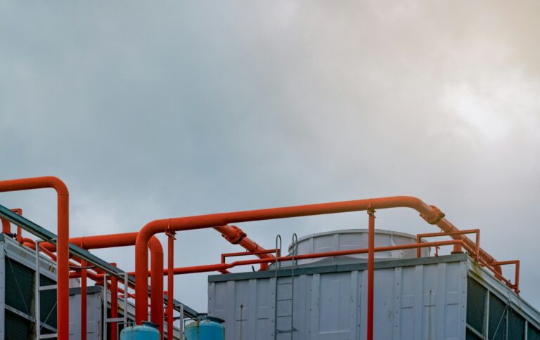 Cooling tower on roof top of building. Industrial air cooling system. Air chiller. Unit of air